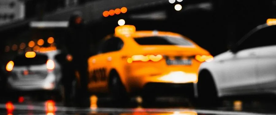 Taxi on a rainy city night